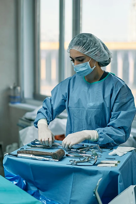 A woman arranging medical tools