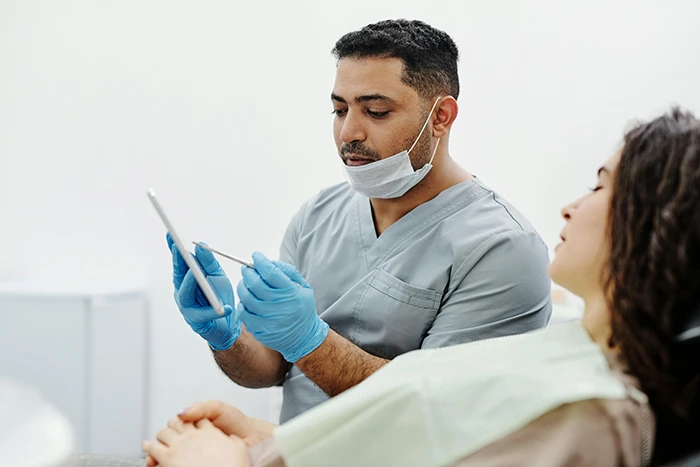 A cosmetic surgeon in a consultation with a patient