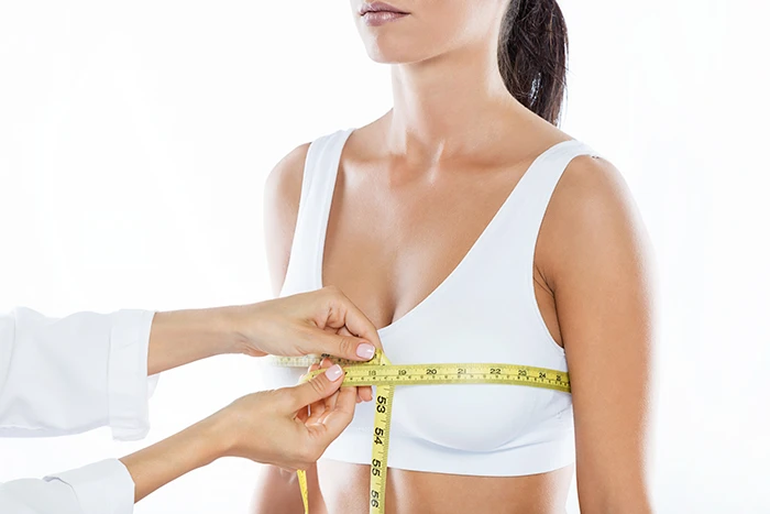 Woman Getting Measurements Taken For Breast Surgery