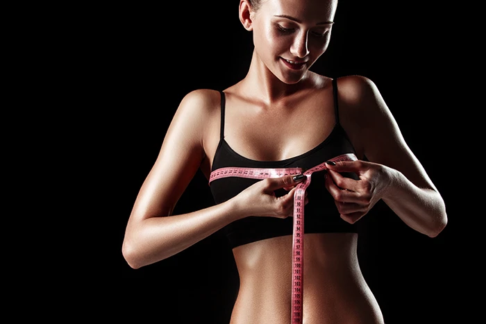 Woman Measuring Her Breast For Surgery