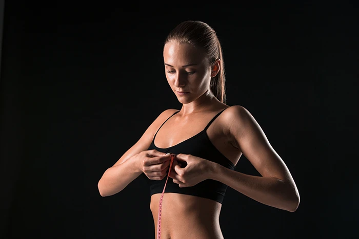 Woman Measuring Her Breast