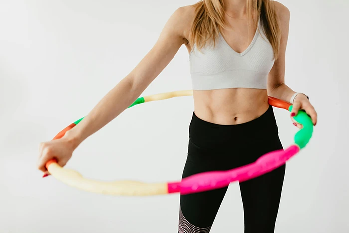 A person holding a hula hoop 