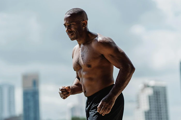 A person in shorts jogging 